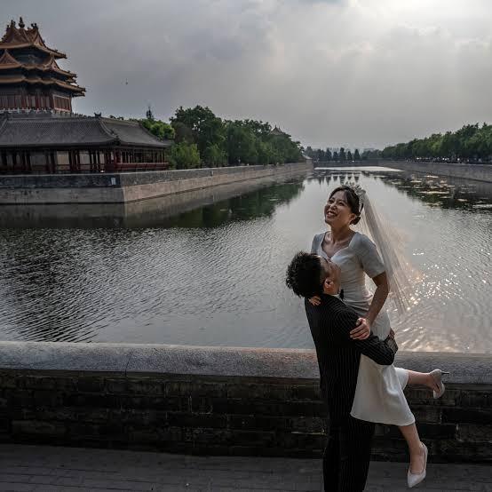 A beautiful Chinese couple, basking in the euphoria of marital bliss.