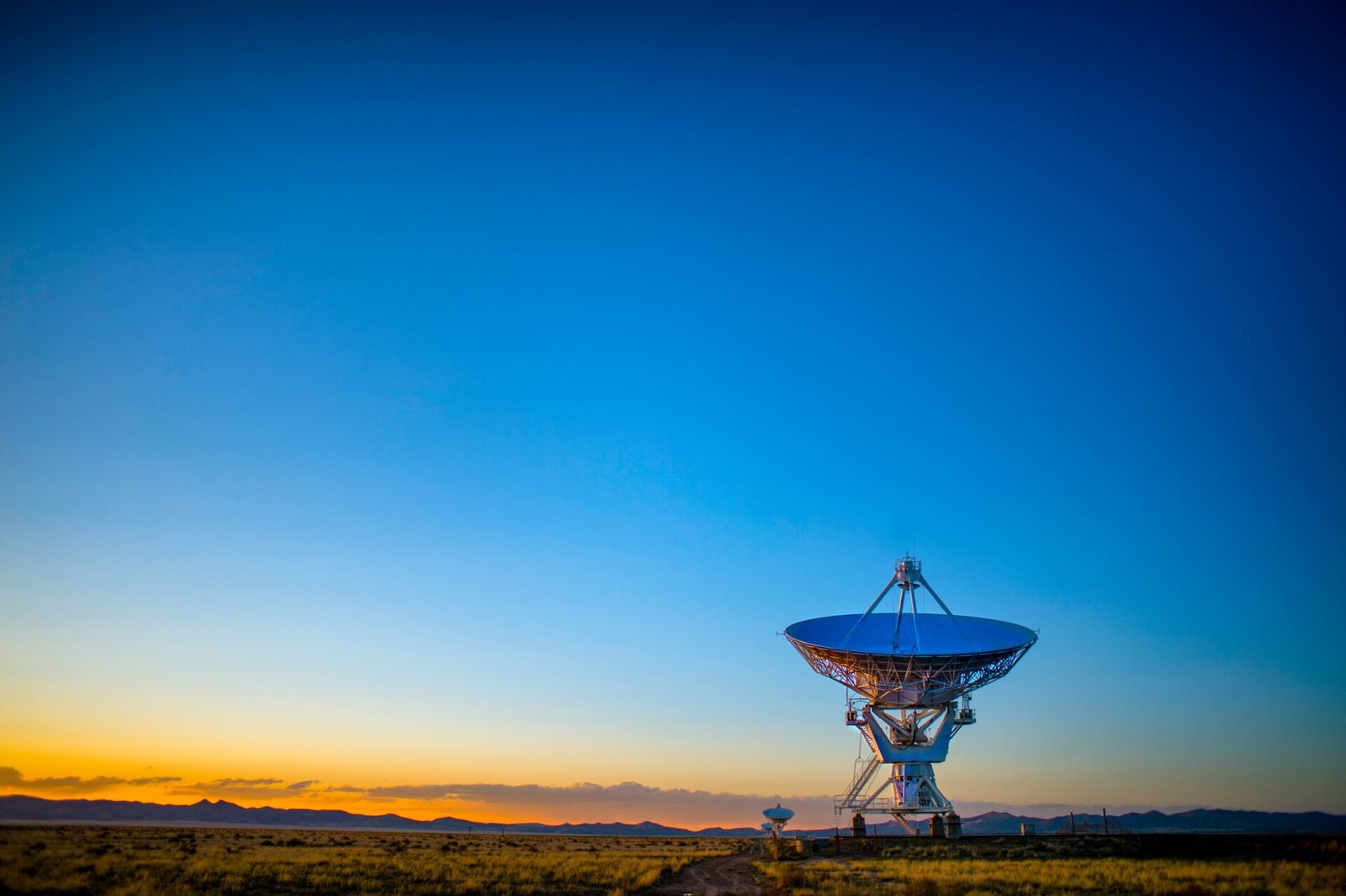 A Satellite dish on earth that communicates with satellites in space.