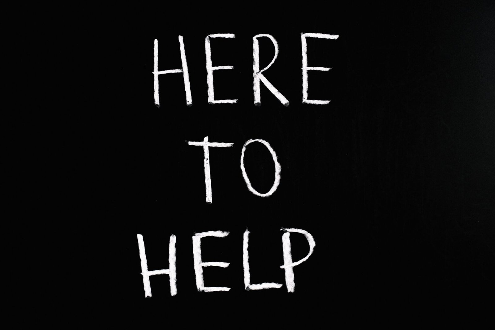 pexels-anna-tarazevich-5697255 Here To Help Lettering Text on Black Background