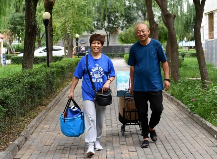 Fan Zhi and Chen Zeying provide essential hygiene services to disabled seniors in their community