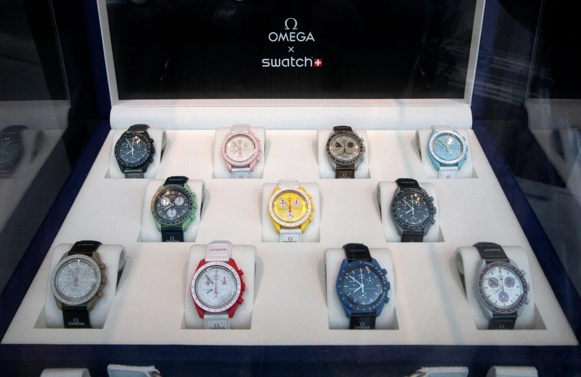 Watches from the Bioceramic MoonSwatch Collection in a window of a Swatch shop in Zurich