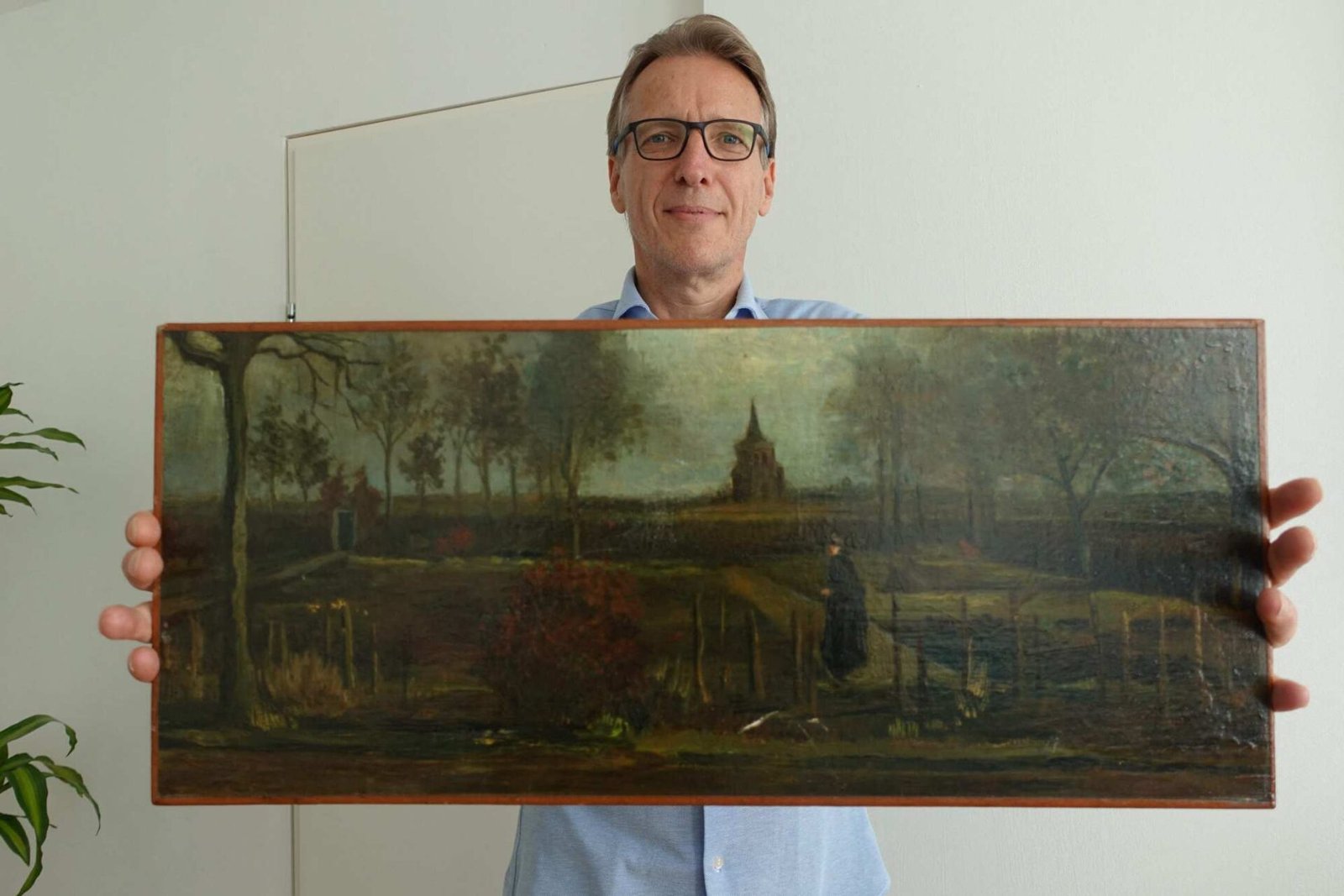 Arthur Brand holding the stolen Van Gogh paint.