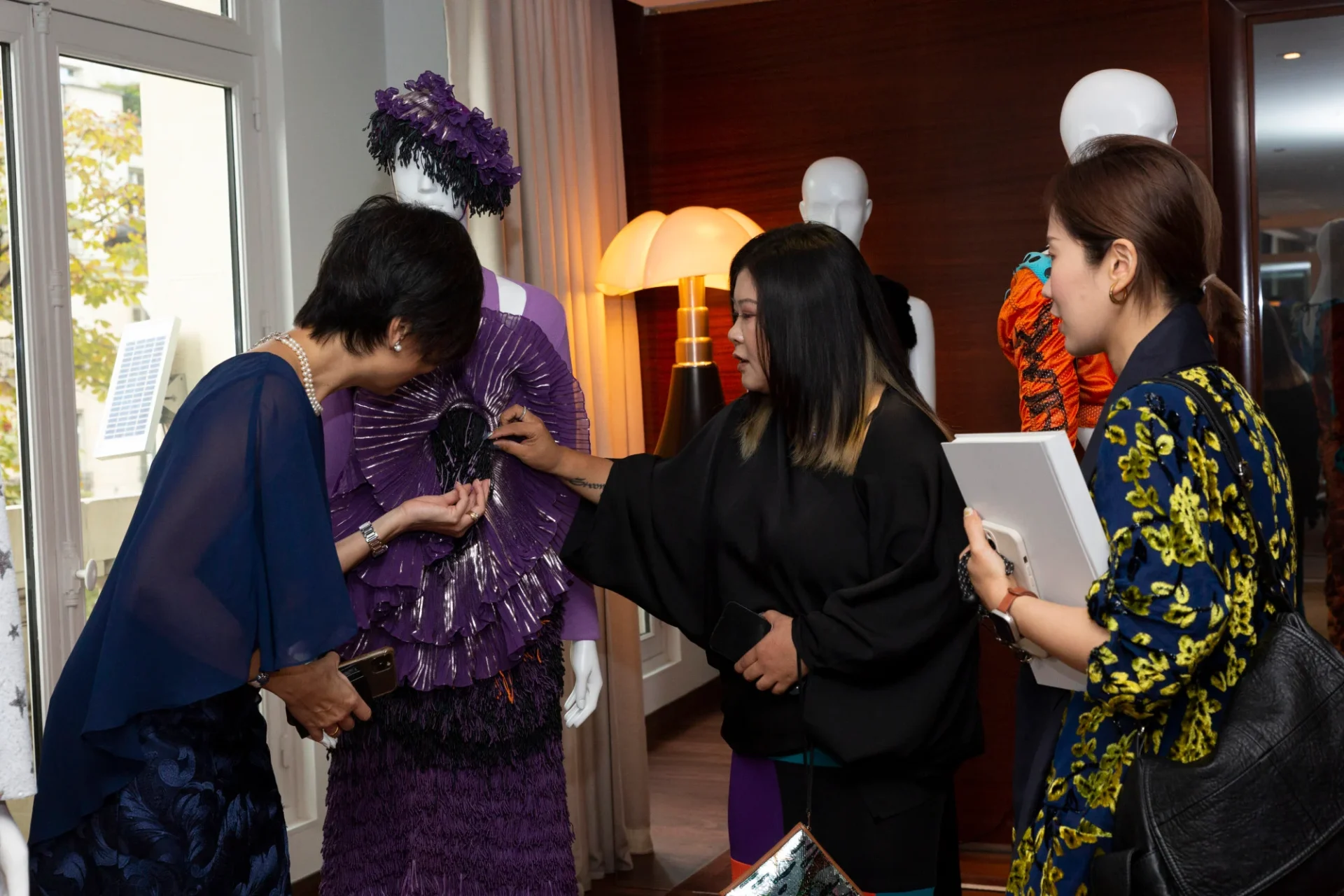 Guests get up close and personal with Chinese designers’ work at the Yu Prize cocktail reception. Photo: Yu Holdings