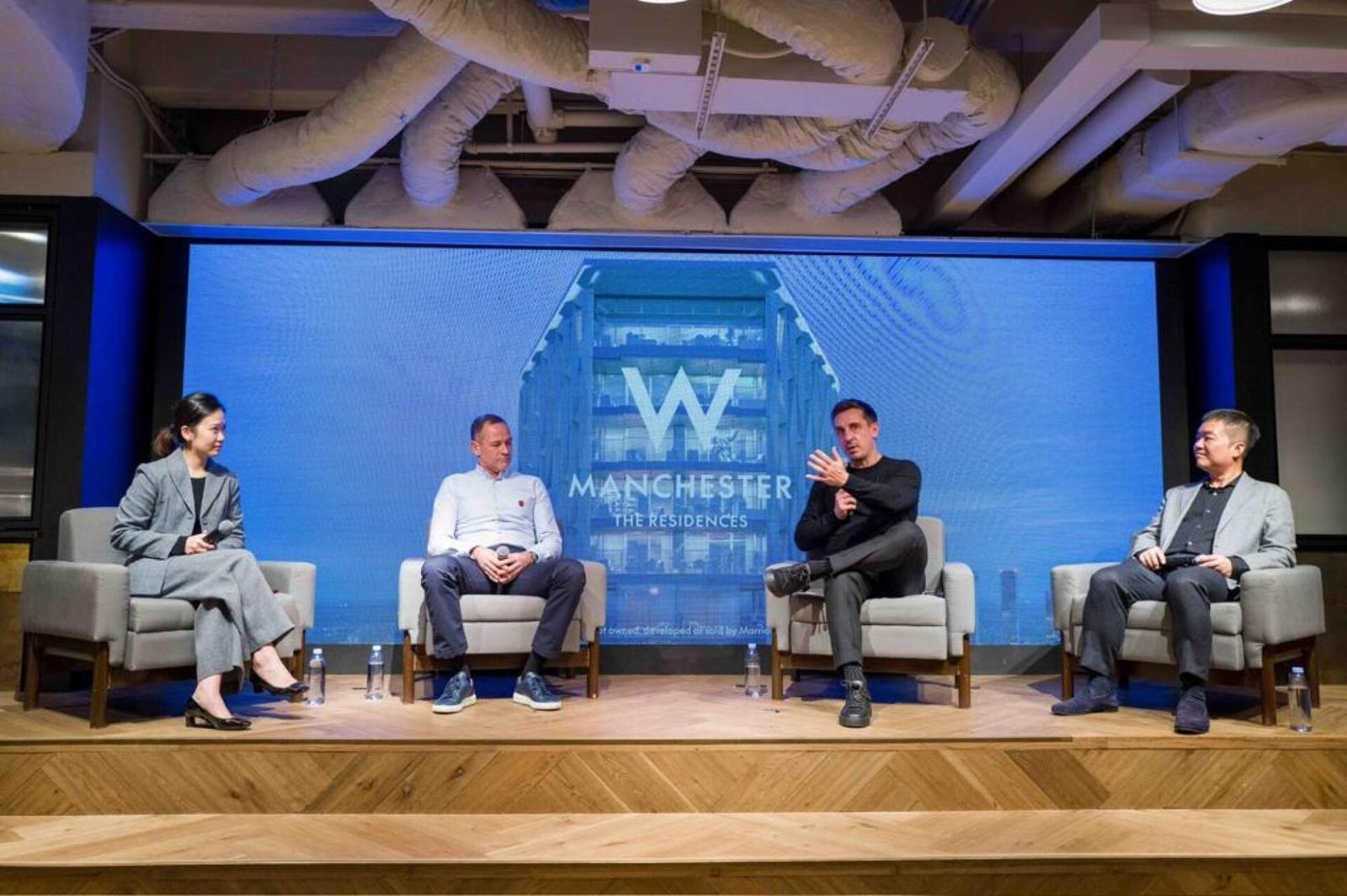 Gary Neville (second right) is seeking buyers in Hong Kong for his new luxury development, the W Residences Manchester.