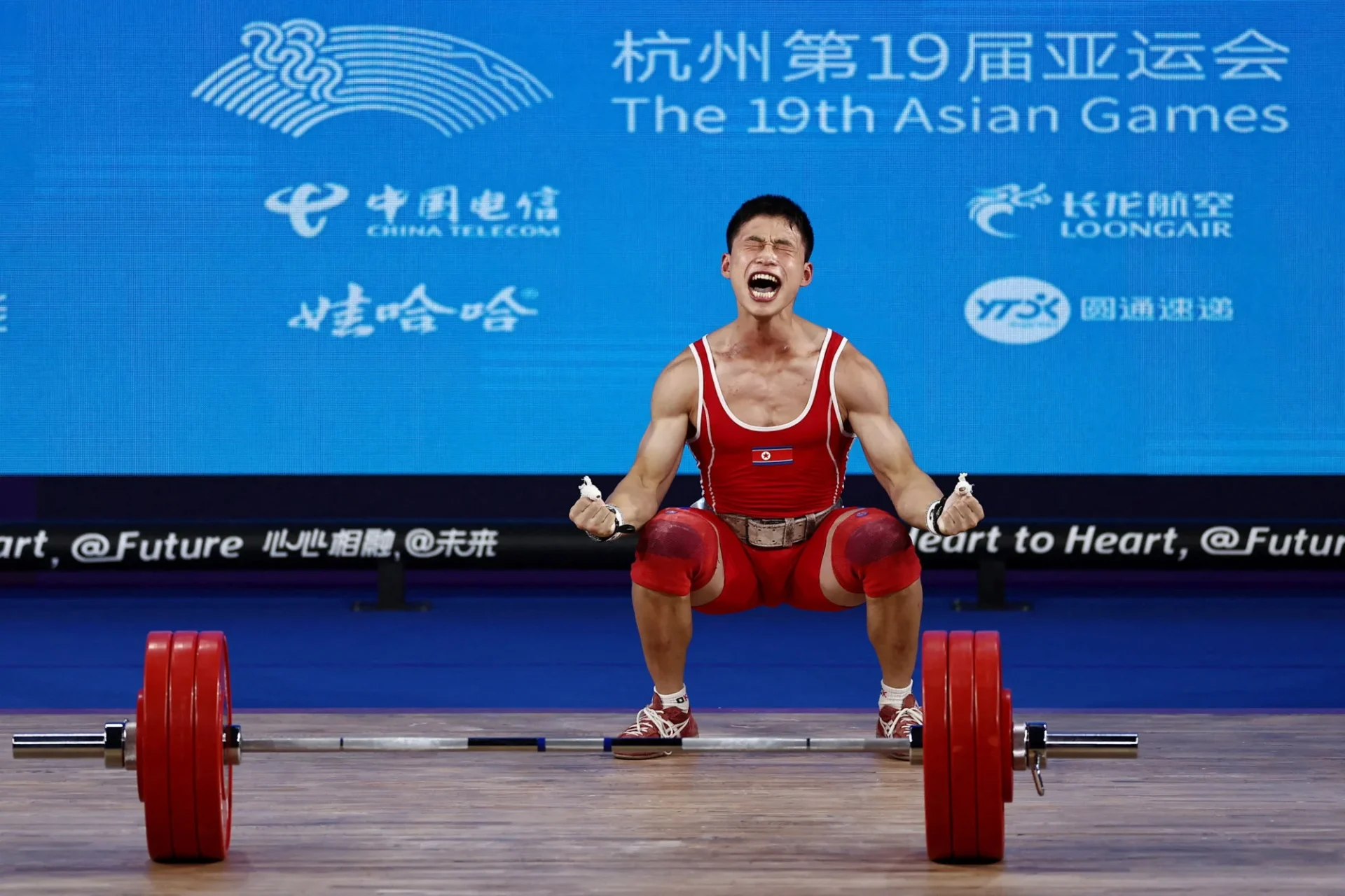 North Korea’s Ri Wonju reacts after a successful lift at the 67Kg weightlifting Group A competition at the Asian Games. Photo: Reuters