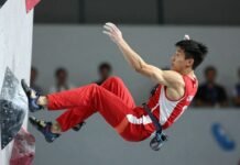 Athlete Long Jianguo wins speed climbing gold medal.