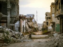 a destroyed building in Syria