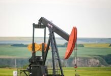 Oil Prices Poised to Skyrocket Past $150 Amid Escalating Middle East Tensions, J.P. Morgan Warns black and orange metal machine on green grass field during daytime