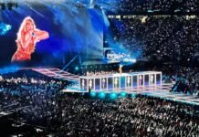 Taylor Swift Dominates 2026 American Music Awards Nominations with Eight Nods a crowd of people watching a woman on a stage