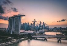 a large body of water with a city in the background